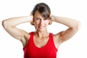 Stressad kvinna på gym